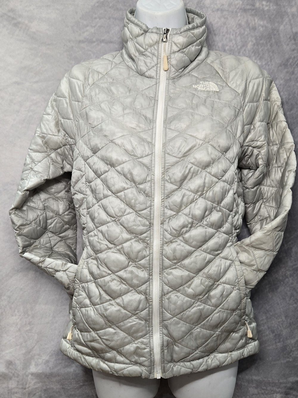The North Face Women's ThermoBall Full Zip Jacket in a light silver-gray